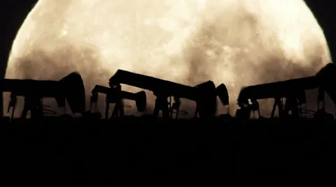 Oil Pumps on a Full Moon Background in a Polluted Environment in Zoom Out Video stock 68998715