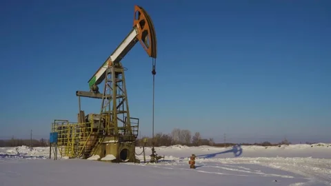 Oil pumps on a winter sunny and frosty day. Oil production in a snowy winter Stock Footage 169073953