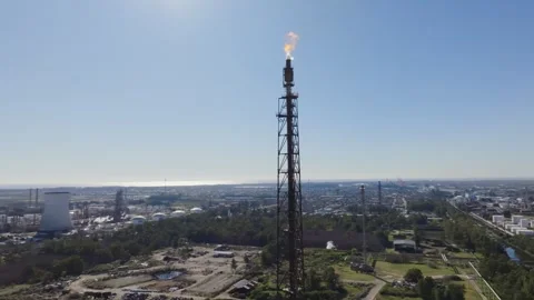 Oil refinery and gas processing plant with flare stack burning gas, aerial view Stock Footage 316214378