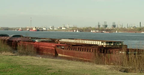 Oil refinery chemical plant barges Mississippi River cancer alley Louisiana Stock Footage