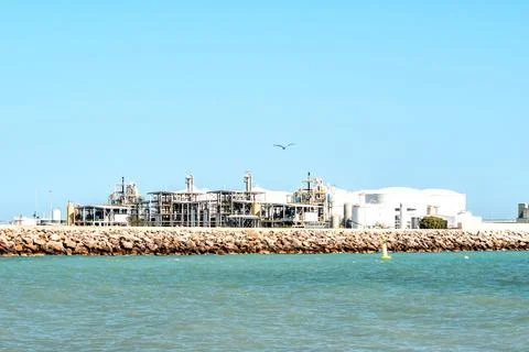 An oil refinery complex, metal structures, storage tanks. A marine terminal Photos