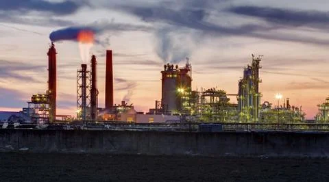 Oil refinery at dramatic twilight Stock Photos