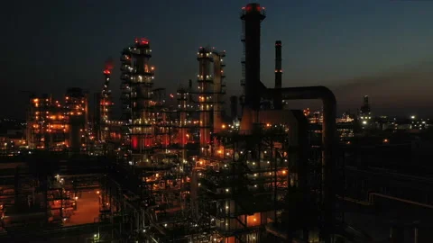 Oil refinery at night. Columns, reactors in color light. Evening illumination of Stock Footage 236653844