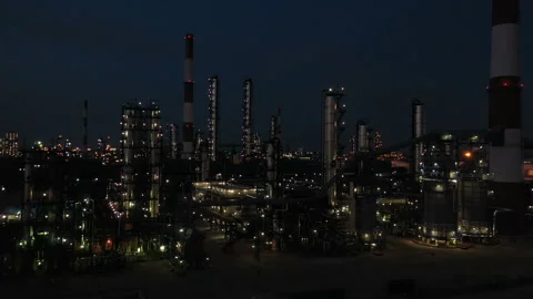 Oil refinery at night. Columns, reactors, pipes in color light. Evening Stock Footage 255245188