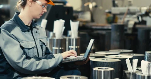 Oil refinery plant engineer in work uniform using laptop computer with Stock Footage 172241485