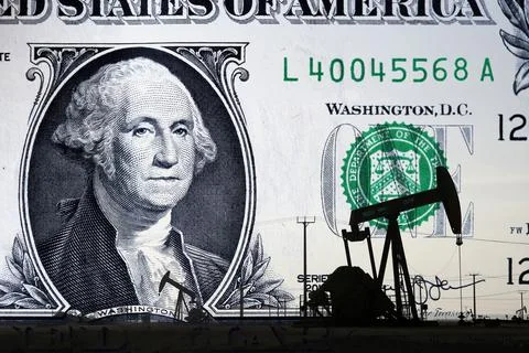 Oil rig and a US dollar bill Stock Photos
