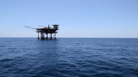 Oil rig gas platform in blue water near continental shelf gulf of mexico Video stock 71414691