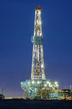 Oil Rig at Night Stock Photos