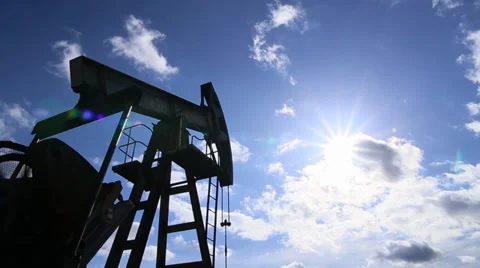 Oil rig pumping over sky. Stock Footage 35413593