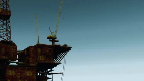 Oil rig structure against clear sky during daylight hours Stock Footage 345062923