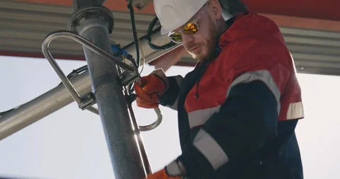 Oil Rig Valve Technician at Work. Oil and Gas Industry. Oil worker wearing 스톡 동영상 108982458