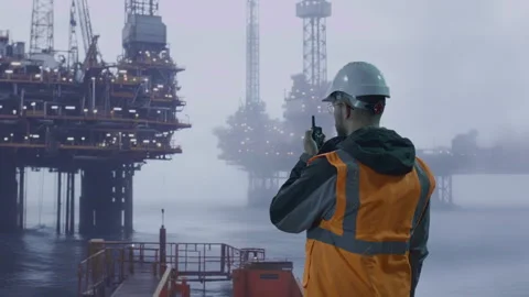 Oil Rig Worker At Dawn Supervising Platform Maritime Industrial Offshore Safety Stock Footage 290952552
