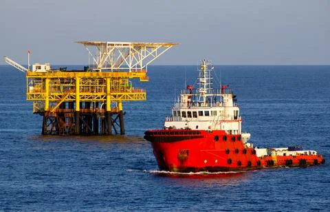 Oil rigs and supply boat Stock Photos