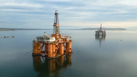 Oil rigs drilling platforms parked estuary awaiting their next operational 動画素材 292012424