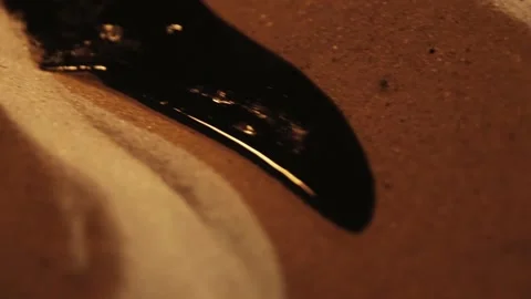 Oil on sand Stock Footage 134460414