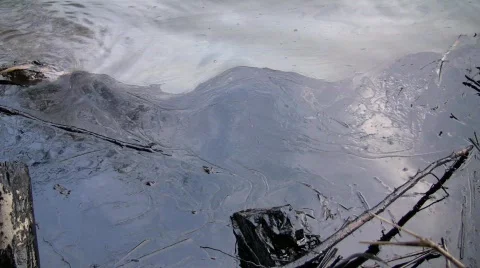 Oil spill in an Amazonian river Stock Footage