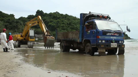 OIL SPILL DISASTER BACK HOE HYDRAULIC EXCAVATOR Stock Footage 27709301
