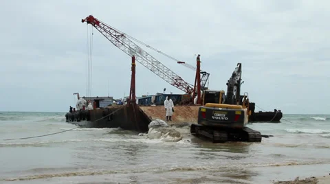 OIL SPILL DISASTER BACK HOE HYDRAULIC EXCAVATOR CRANE BARGE Stock Footage 27731547