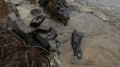 OIL SPILL DISASTER BLACK SLUDGE SLICK WATER Stock Footage 27877022