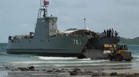 OIL SPILL DISASTER BUCKET LOADER BULLDOZER LANDING CRAFT Stock Footage 27796806