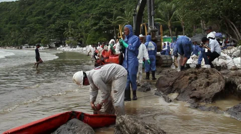 OIL SPILL DISASTER WORKERS BOOM Stock Footage 27764109