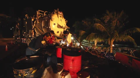 OIL SPILL DISASTER WORKERS NIGHTTIME CLEAN UP Stock Footage 27843886