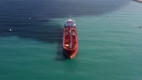 Oil spills out of a ship to Sea- Aerial View Stock Footage