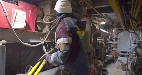 Oil supervisor checking pressure sensors Stock Footage 258021054