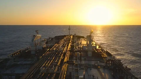 Oil tanker ship on the sea while sunset - timelaps. Stock Footage 77363602