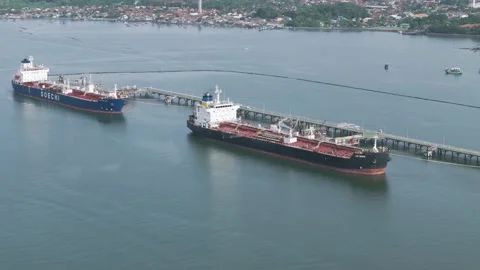 Oil tankers lined up loading and unloading oil Stock Footage 327892213