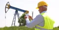 Oil Technician Person Use Tablet Software Verify Maintenance Periodic Checking 4k or 4k+ Resolution