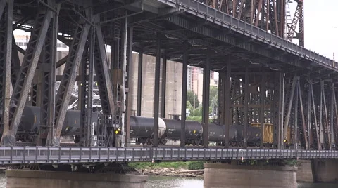 Oil train crossing bridge Stock Footage 64912682