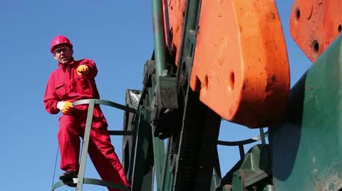 Oil Worker and Pump Jack Stock Footage 12467222