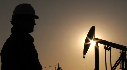 Oil worker wiping brow Stock Footage