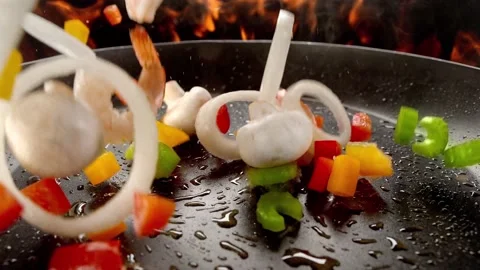 Oiled frying pan sprinkle with stir-fried shrimp. 4K Footage Stock Footage 232985656