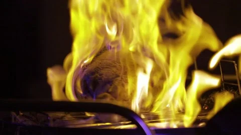 Oiling and burning lamb shank. Close up lamb shank processing with torch burner. Stock Footage 143255221