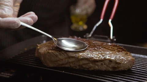 Oiling beef steak Stock Footage 64478857