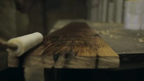 Oiling a Length of Timbe Stock Footage 70304568