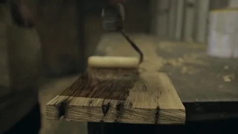 Oiling a Length of Timber Stock Footage 70304185