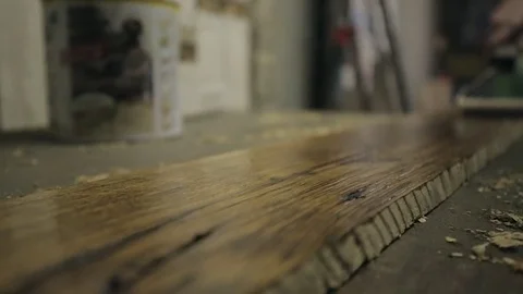 Oiling a Length of Timber Stock Footage 70304595