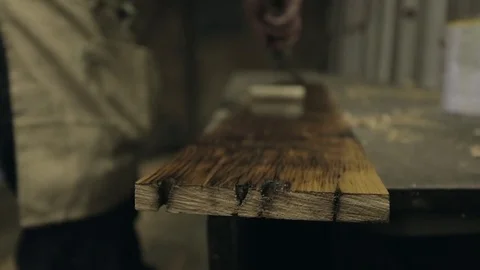 Oiling a Length of Timber Stock Footage 70304736