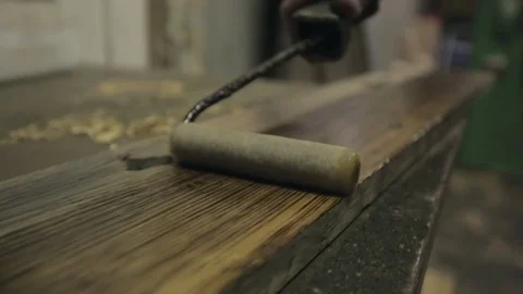 Oiling a Length of Timber Stock Footage 70304862