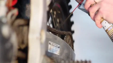 Oiling (lubing) motorcycle chain Stock Footage 46090505