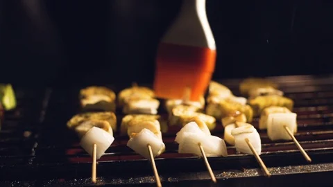 Oiling skewers on fire. Stock Footage 116396961