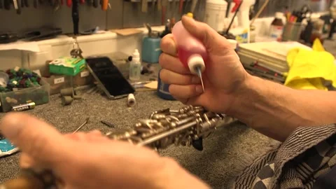 Oiling a soprano saxophone Stock Footage 137862924