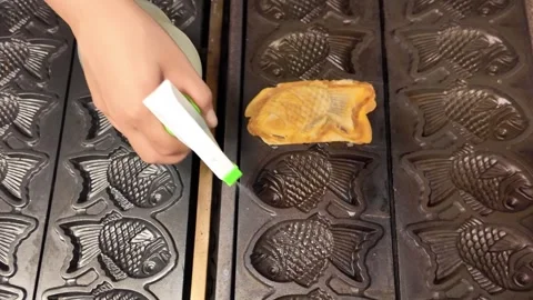 Oiling Taiyaki fish waffle mold, Thailand Stock Footage 344373327
