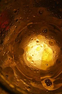 Oil,light and water combination.Abstract golden background Stock Photos
