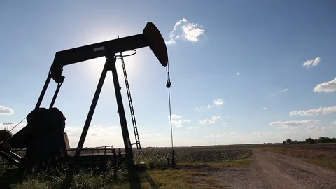 Oilwell Pump Jack in a Field Close Silhouette Stock Footage 89237771