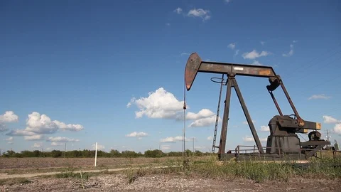 Oilwell Pump Jack in a Field Stock Footage 89237846