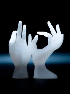 OK hand shape resin ring display holder for jewelry display on dark backgroun 스톡 사진
